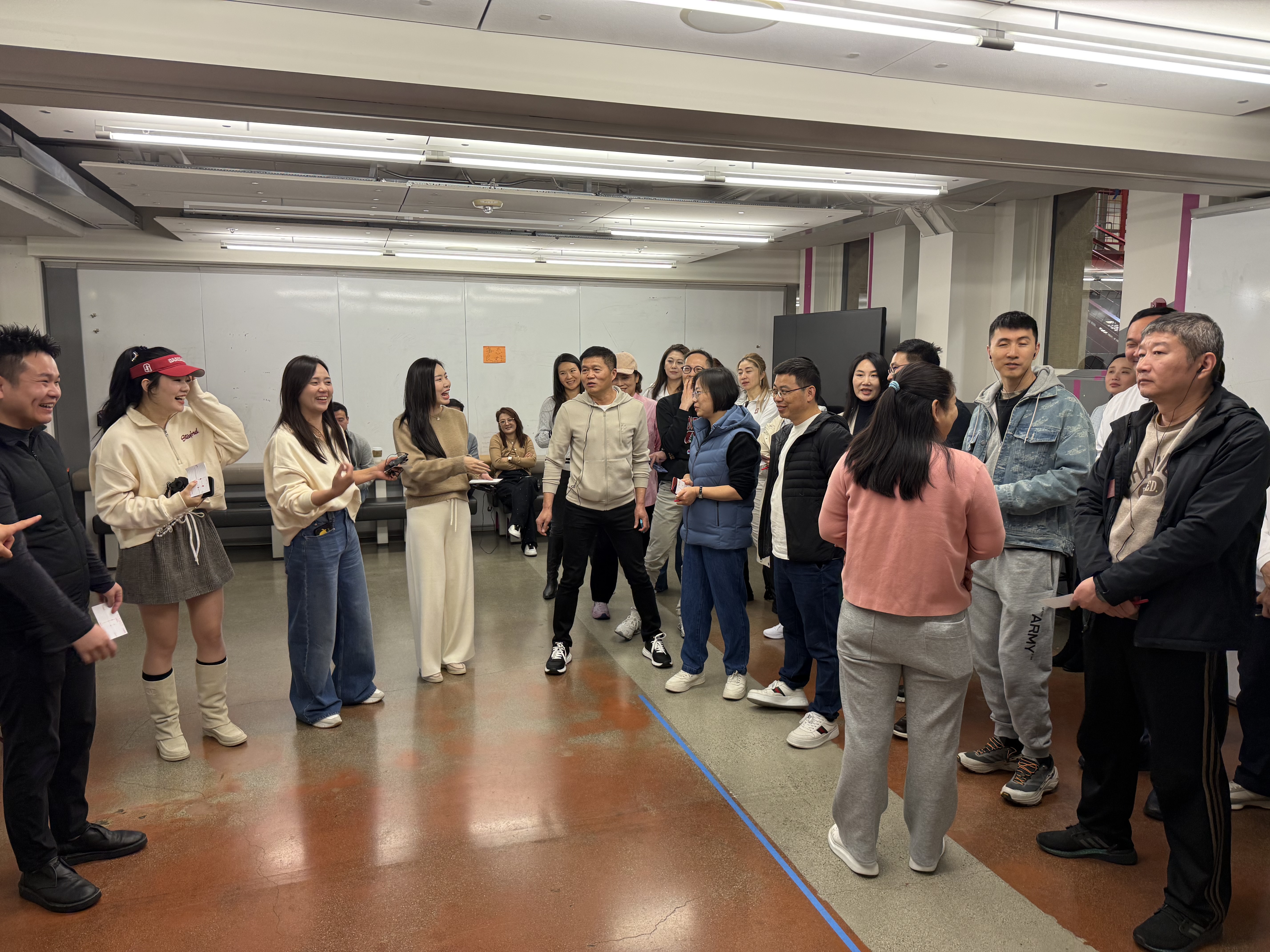 Participants physically positioning themselves during the Futures Game, split across a live 2x2 matrix